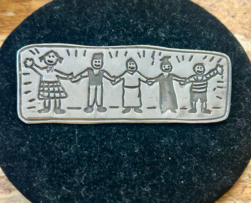 Sterling Silver brooch depicting a family