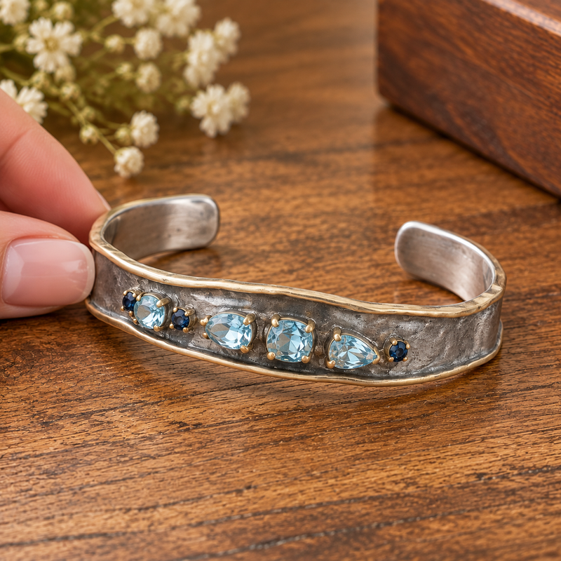 Sterling Silver Cuff, Decorated with Blue Sapphires and Sky-Blue Topaz, Plated with 3 Micron 22K Yellow Gold and White Rhodium
