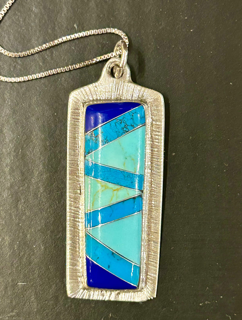 Sterling silver turquoise and lapis inlay pendant on am 18 “ sterling silver chain