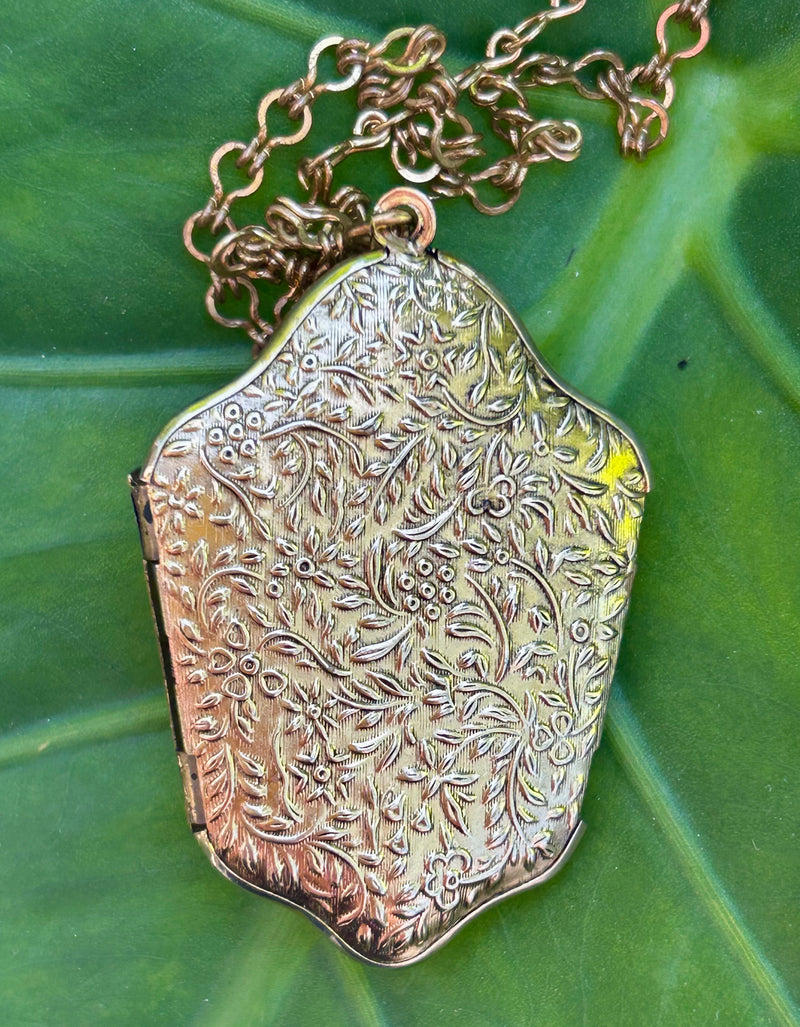 1940's gold filled bi-fold locket 1 1/4” x 2”  with 24” gold filled chain