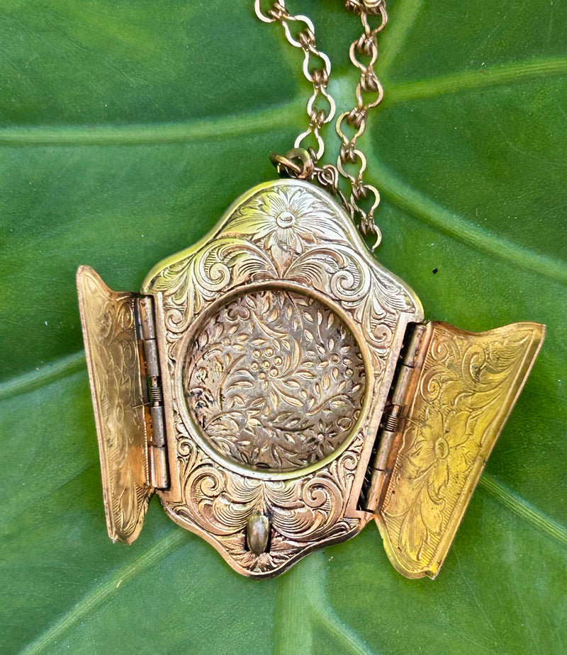1940's gold filled bi-fold locket 1 1/4” x 2”  with 24” gold filled chain