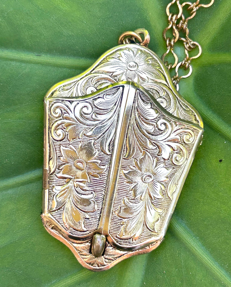 1940's gold filled bi-fold locket 1 1/4” x 2”  with 24” gold filled chain