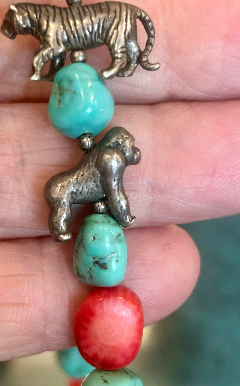 Vintage Zuni coral and turquoise with sterling animal charms 28” long