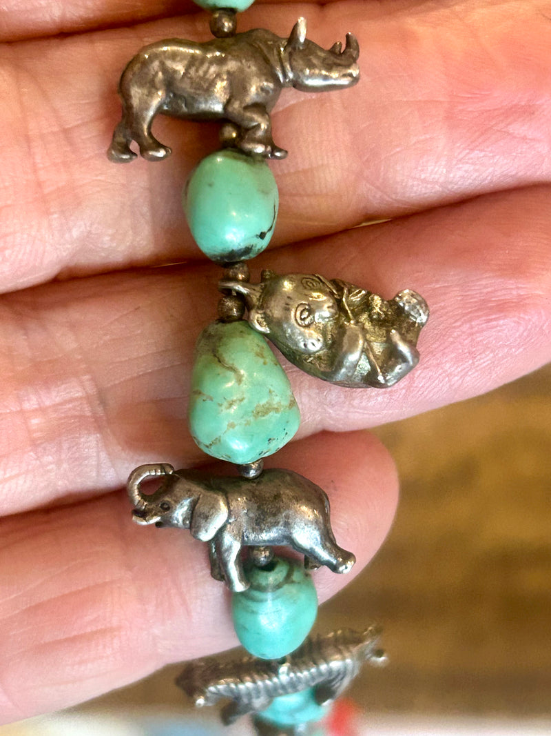Vintage Zuni coral and turquoise with sterling animal charms 28” long