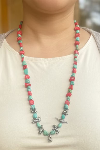 Vintage Zuni coral and turquoise with sterling animal charms 28” long