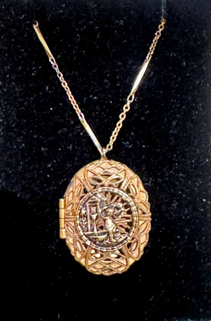 Gold filled locket with a red beaded  necklace
