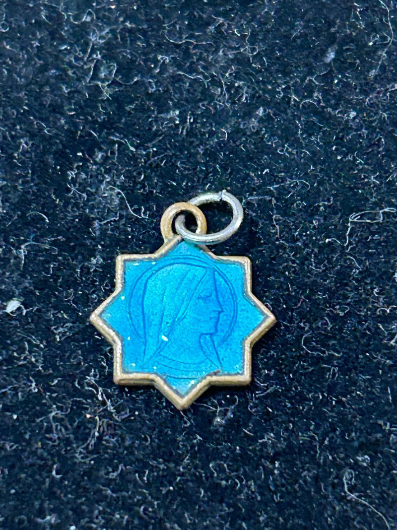 Tiny blue religious metal