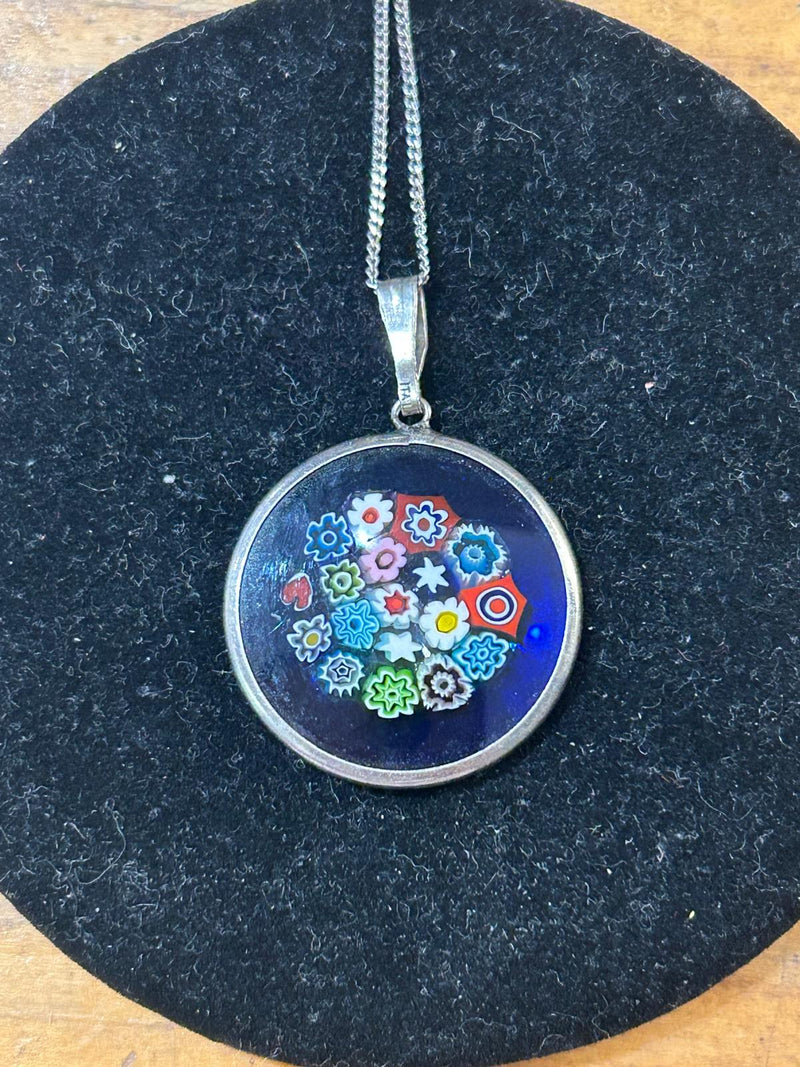 Vintage Sterling Silver Millefiori pendant on a 18 inch sterling silver chain; with a royal blue glass background, made in italy