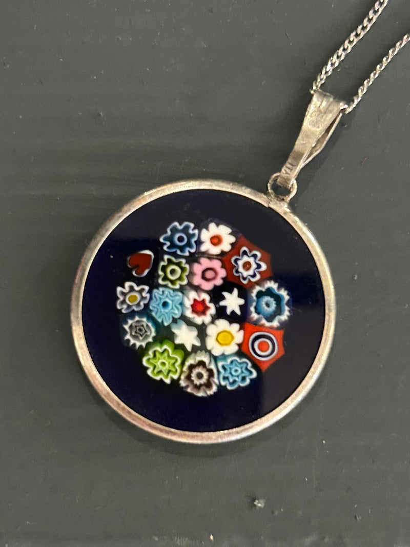 Vintage Sterling Silver Millefiori pendant on a 18 inch sterling silver chain; with a royal blue glass background, made in italy